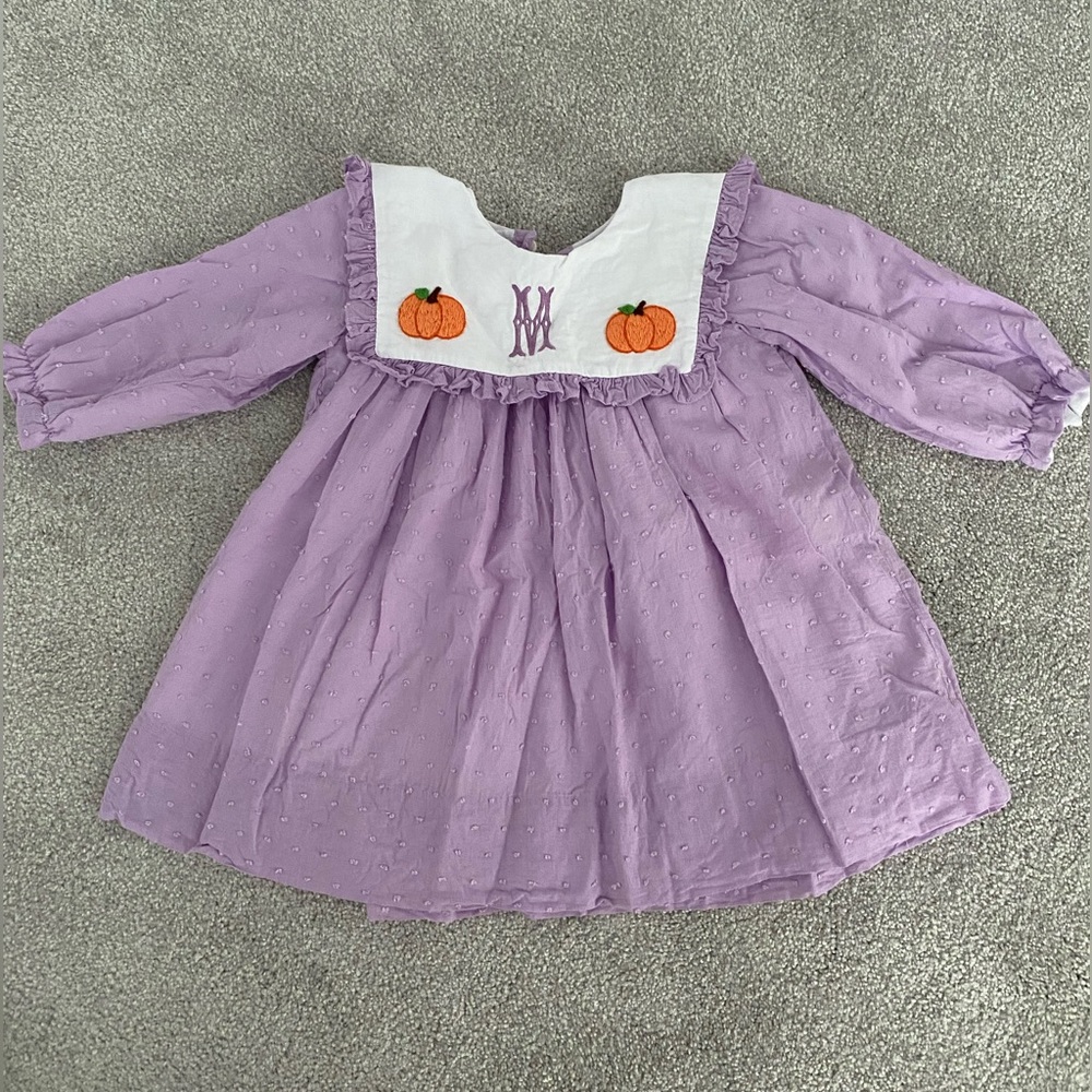 Pumpkin dress with “M” monogram initial
